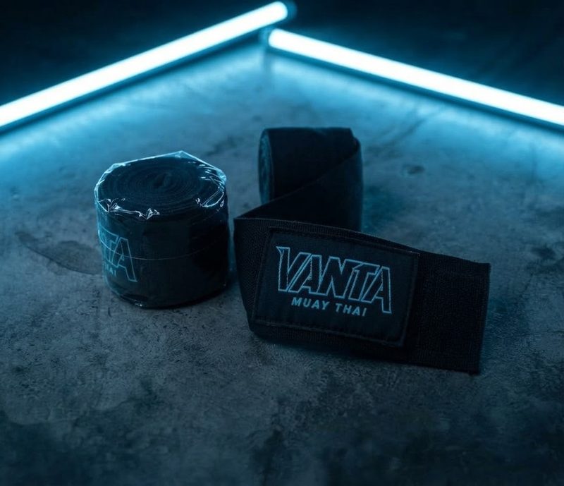 Black Vanta hand wraps with teal logo patch