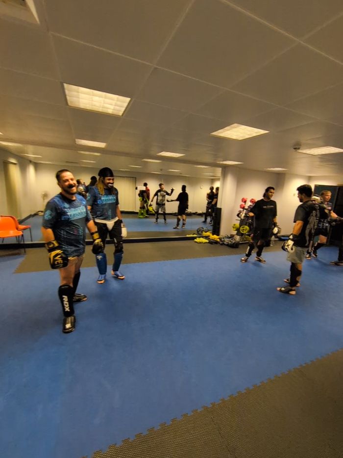 Members smiling between sparring rounds