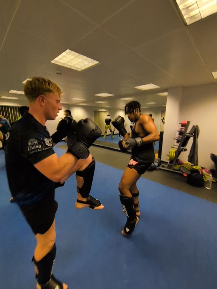 Knee strike drill with shin guards