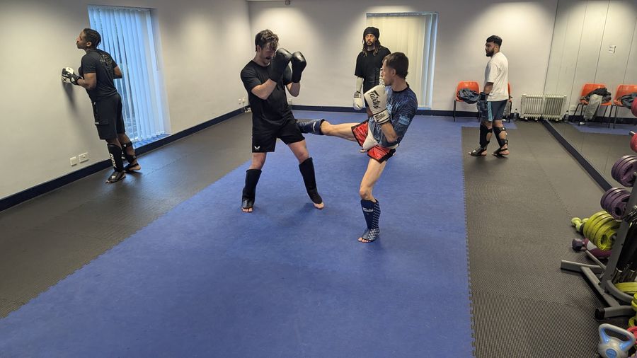 Roundhouse kick to the body during partner drills